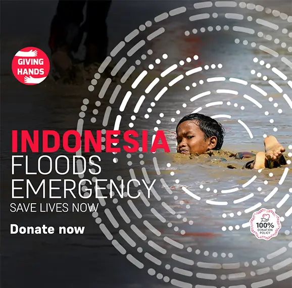 Giving Hands Indonesia floods emergency appeal banner urging donations to save lives, featuring 100% donation policy