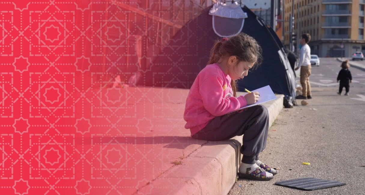 Lebanon emergency child studying beside shelter
